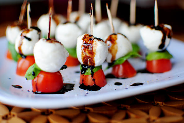Caprese skewers with balsamic drizzle on a plate