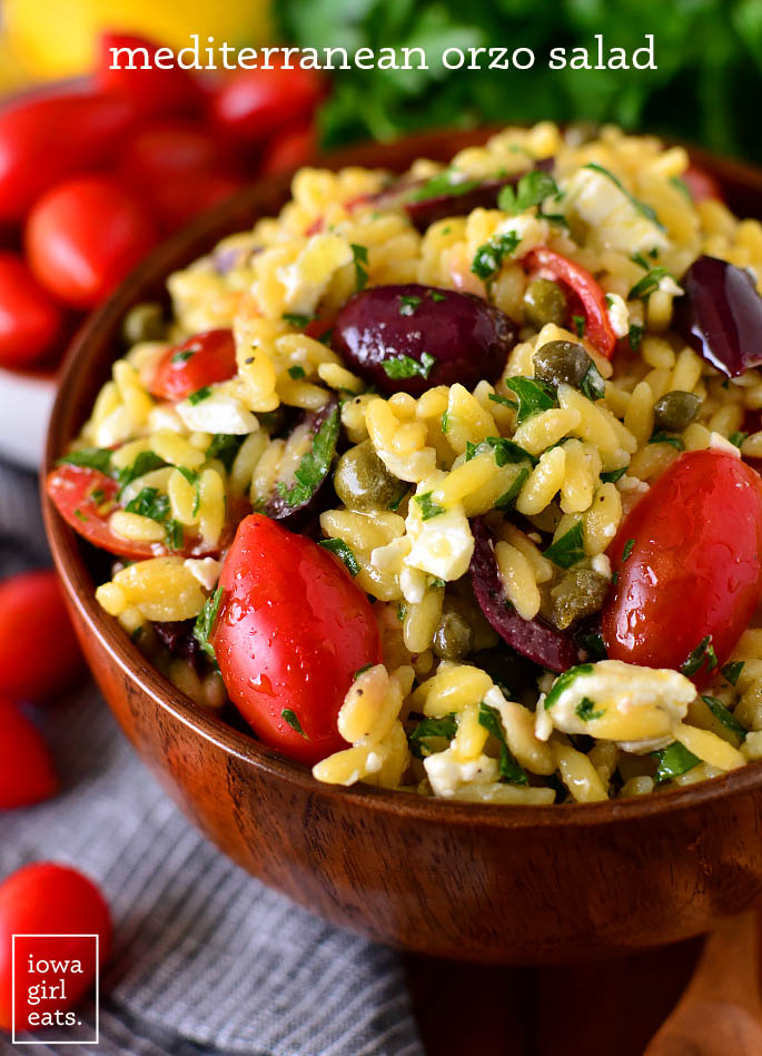 Close up photo of a serving bowl of Mediterranean Orzo Salad