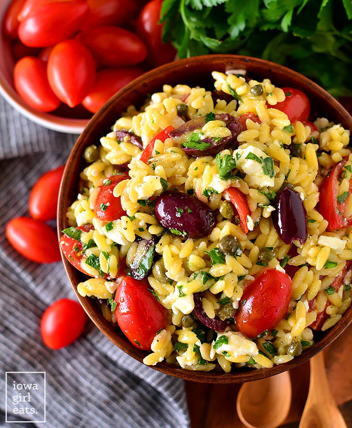 overhead photo of a serving bowl of Mediterranean Orzo Salad