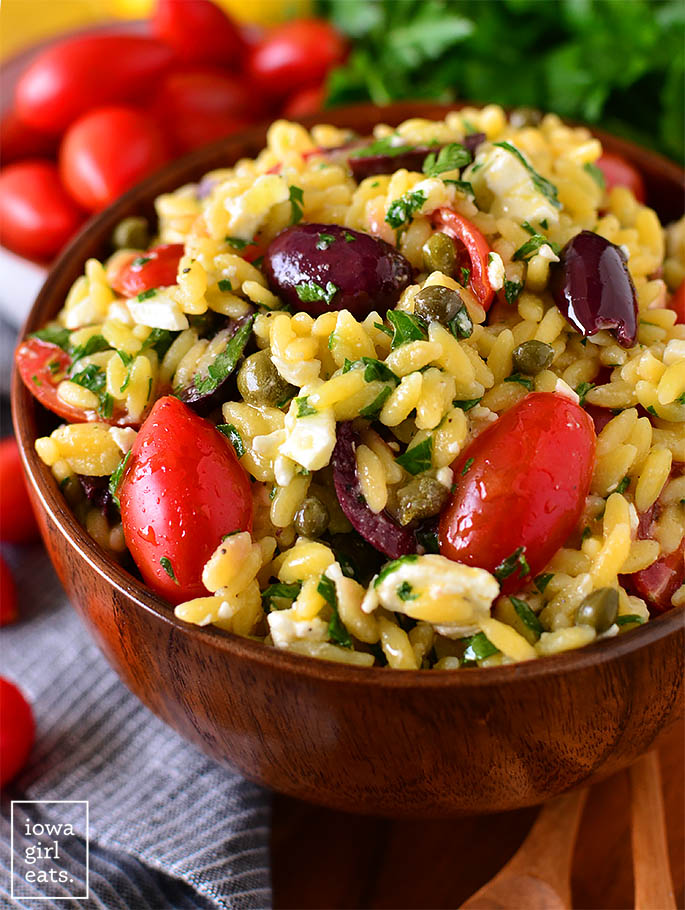 Mediterranean Orzo Salad in a wooden serving bowl