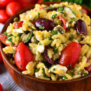 Mediterranean Orzo Salad in a wooden serving bowl