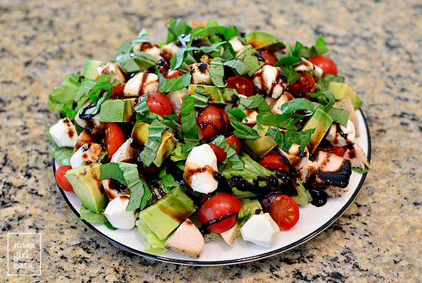 avocado and chicken caprese salad ingredients on a plate