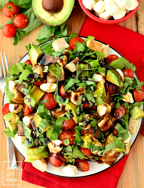 overhead photo of an avocado and chicken caprese salad