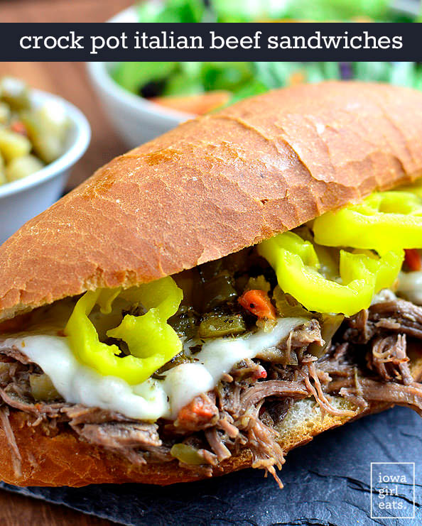 Crock pot italian beef sandwich with cheese and toppings