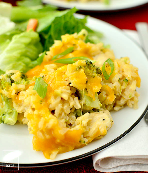 Healthy Cheesy Chicken and Broccoli-Rice Casserole on a plate with a bite taken out