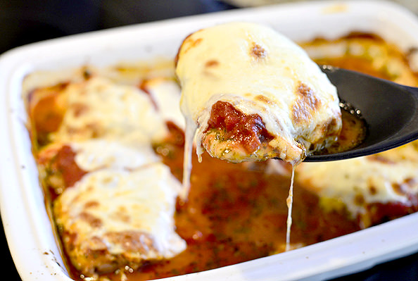 Baked Pesto Chicken Parmesan #chicken #chickenthighs #dinner | iowagirleats.com