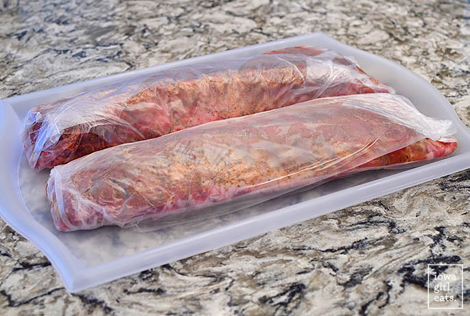 seasoned ribs wrapped in saran wrap