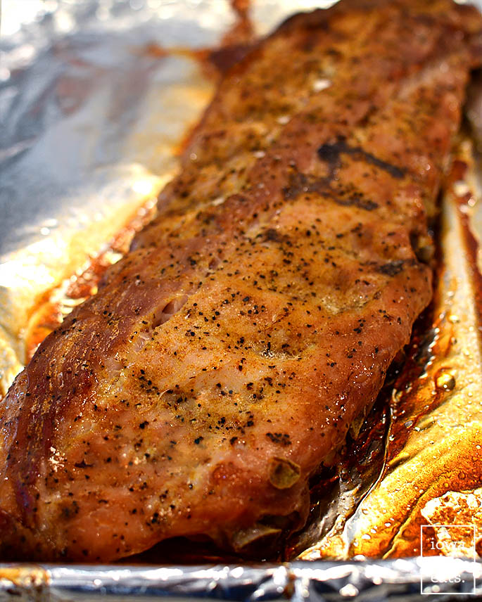 rack of baked ribs on a baking sheet