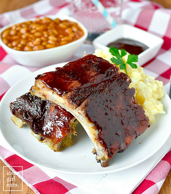 baked ribs on a plate with potato salad