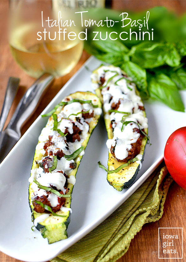 Italian Tomato-Basil Stuffed Zucchini is a light and low-carb, gluten-free summer dinner recipe. Simple and satisfying. | iowagirleats.com