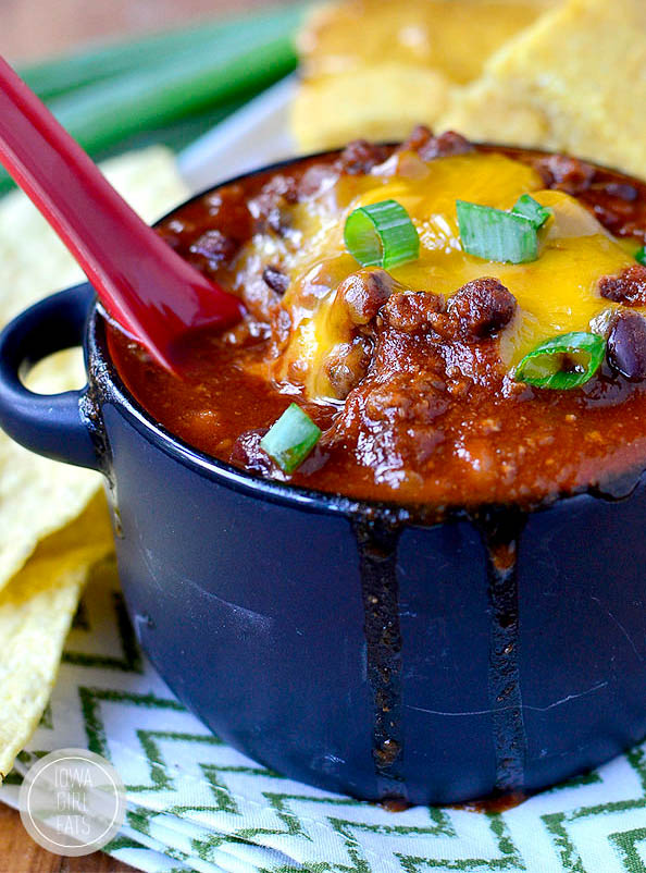 spoon dunked into a bowl of signature chili