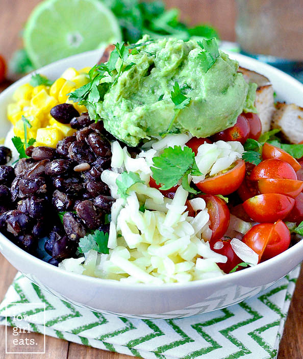 fresh homemade chicken burrito bowl with toppings