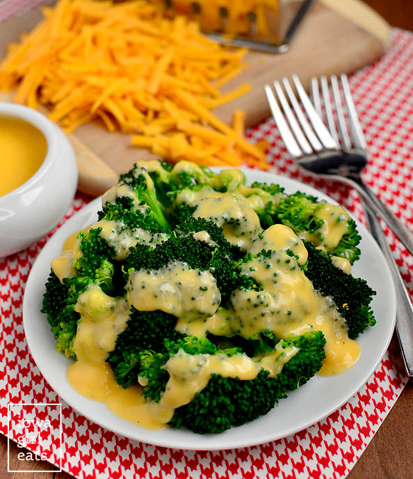 cheddar cheese sauce over cooked broccoli