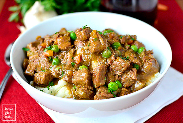 beef stew over mashed potatoes in a bowl
