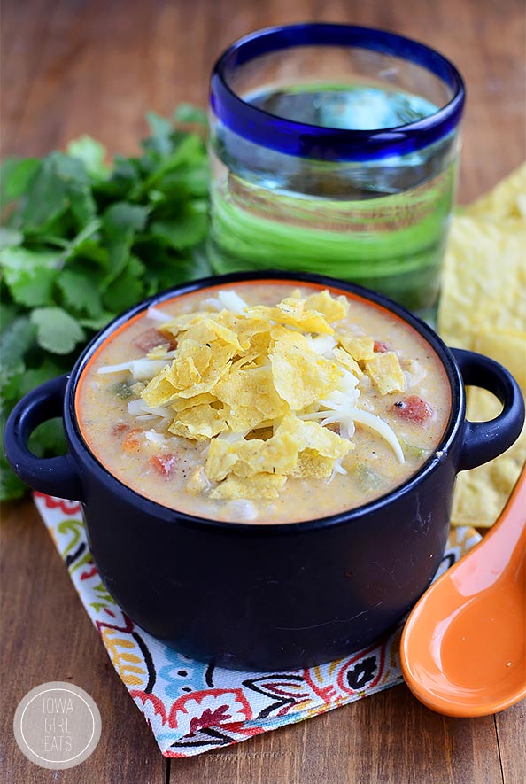 Gluten-free White Queso Chicken and Rice Soup tastes like white queso dip but is made with zero processed cheese. This easy soup recipe is creamy, cheesy and delicious! | iowagirleats.com
