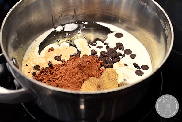 Gluten-Free Turtle Brownie Sundaes with Salted Caramel Whipped Cream and Homemade Hot Fudge Sauce #glutenfree #dessert #valentinesday | iowagirleats.com