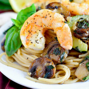 sauteed shrimp on pasta with mushroom and zucchini