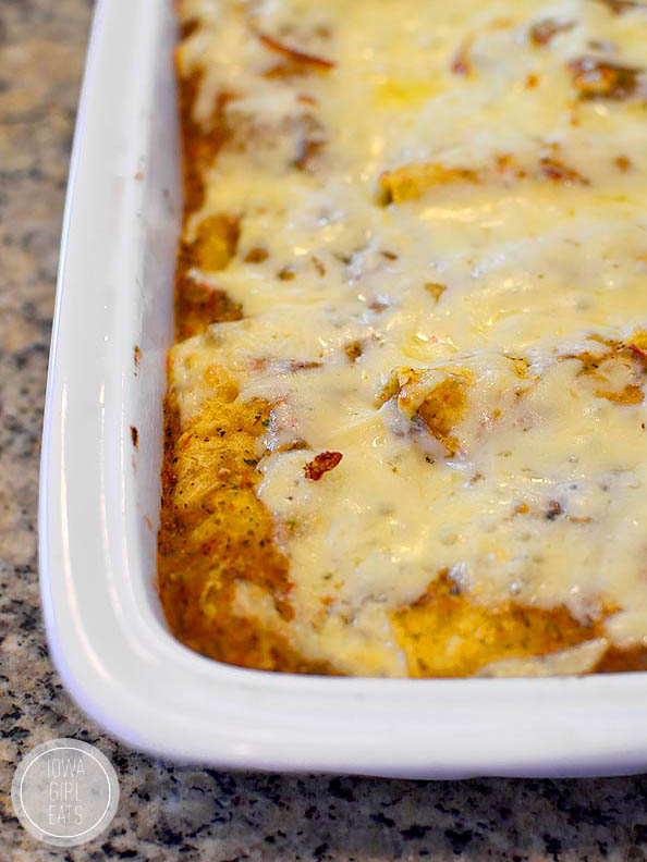hot roasted poblano chicken enchiladas in a baking dish