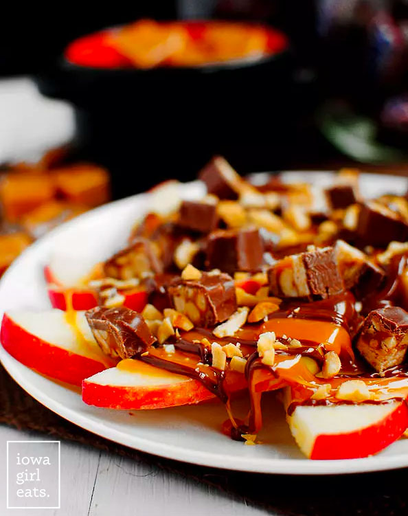 close up photo of a plate of apple snicker nachos