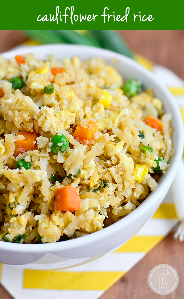 Cauliflower Fried Rice will trick your tastebuds in the best way possible. This grain-free, dairy-free, and vegetarian dish will be a hit at your house! #glutenfree #dairyfree | iowagirleats.com
