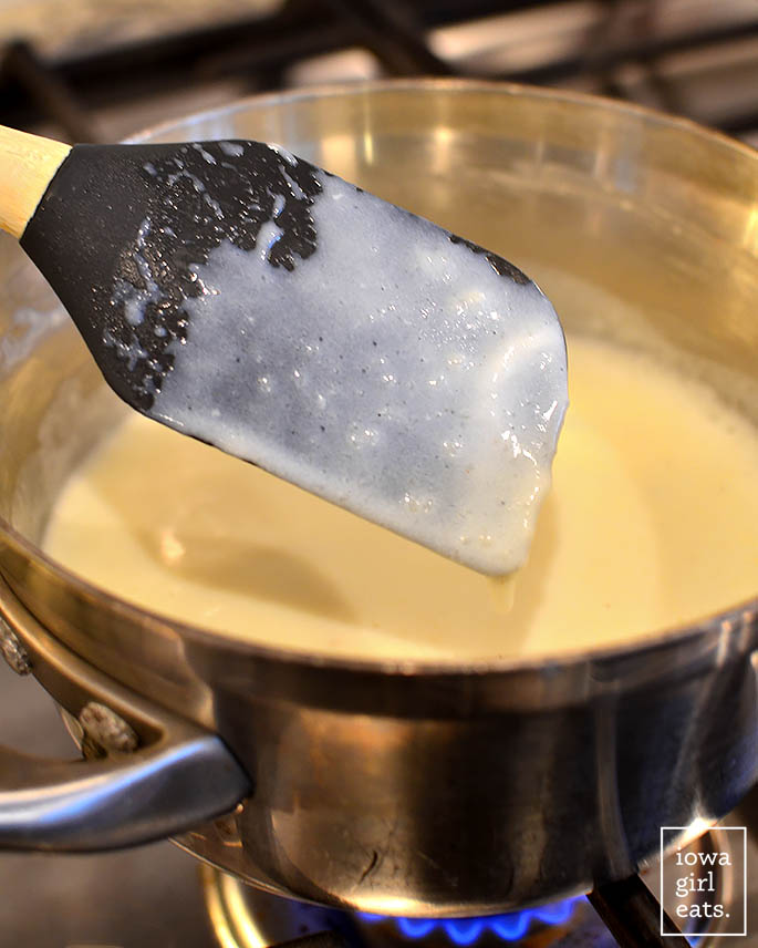 Heat the thickened roux and milk in a pan