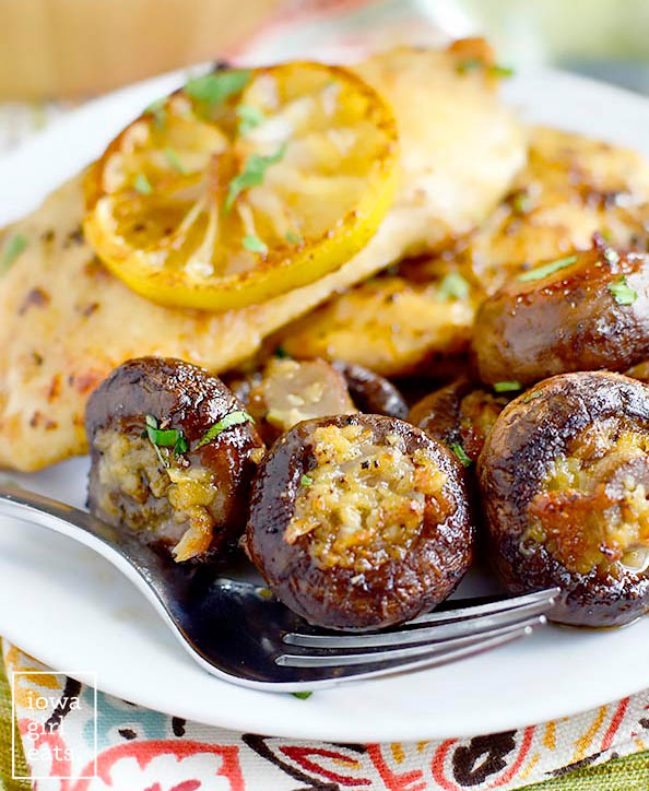 easy garlic butter roasted mushrooms on a plate with chicken