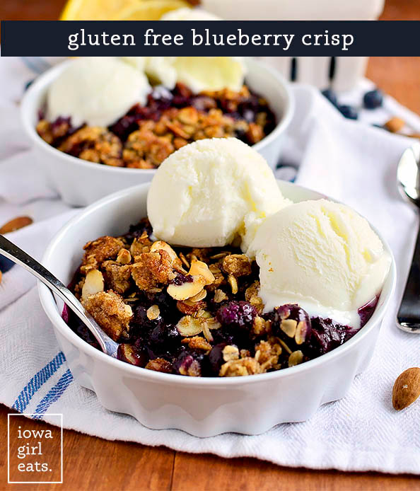 two dishes of gluten free blueberry crisp with ice cream