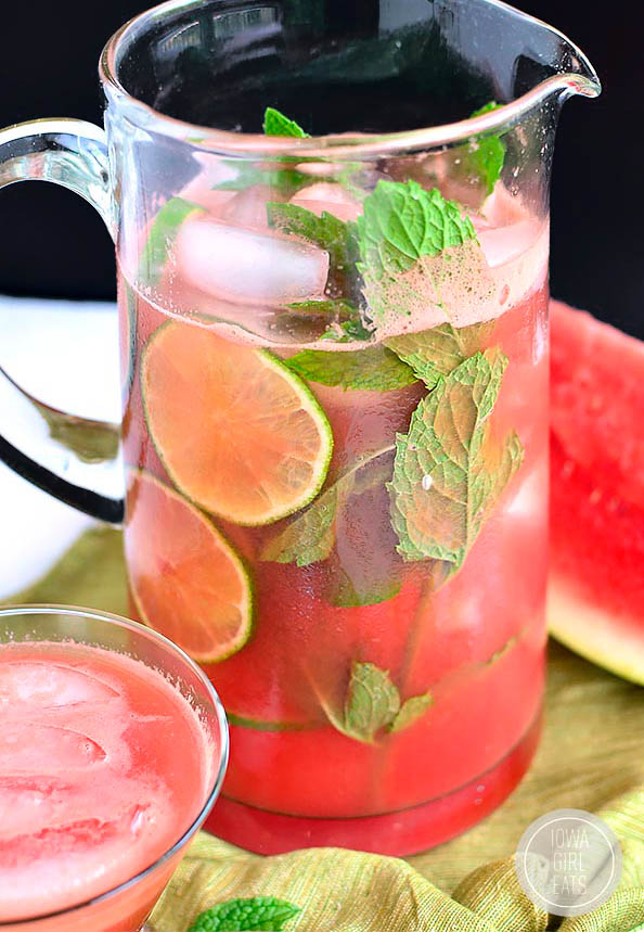 pitcher of watermelon agua fresca with limes an dmint
