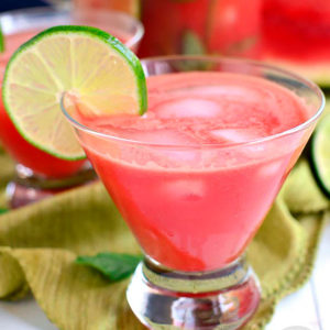 watermelon aqua fresca in a glass with a lime