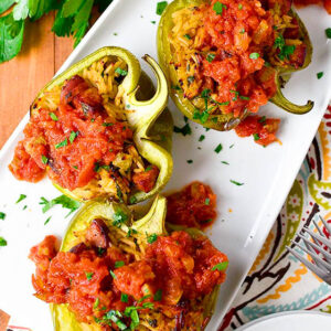 dirty rice stuffed peppers on a platter