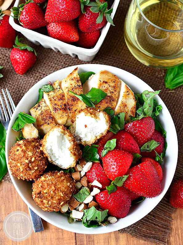 overhead photo of fried goat cheese balls on a strawberry basil chicken salad