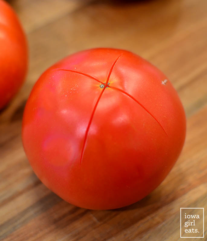 tomato with an x scored on the bottom