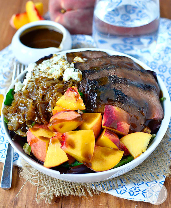 grilled steak and peach salad in a bowl