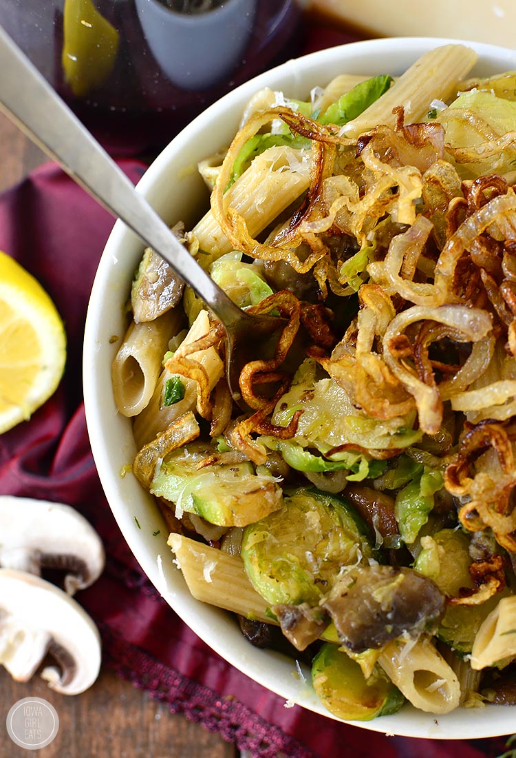 Mushroom and Brussels Sprouts Penne with Crispy Fried Shallots is a delicious meatless main with an expected, oniony crunch! | iowagirleats.com