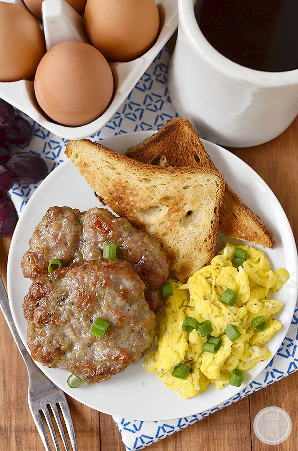 Overhead photo of plate of eggs, toast and breakfast sausage