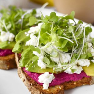 Avocado and Shortcut Beet Hummus Toast is a nutritional powerhouse! Eat for breakfast to power through your morning, or anytime you need a boost. Easily made gluten-free, too! | iowagirleats.com