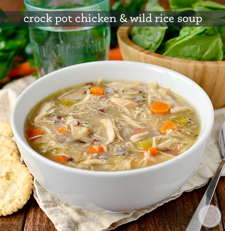 crock pot chicken and wild rice soup in a bowl with a salad