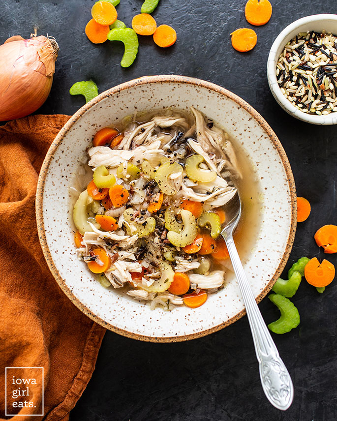 overhead photo of a bowl of crock pot chicken wild rice soup