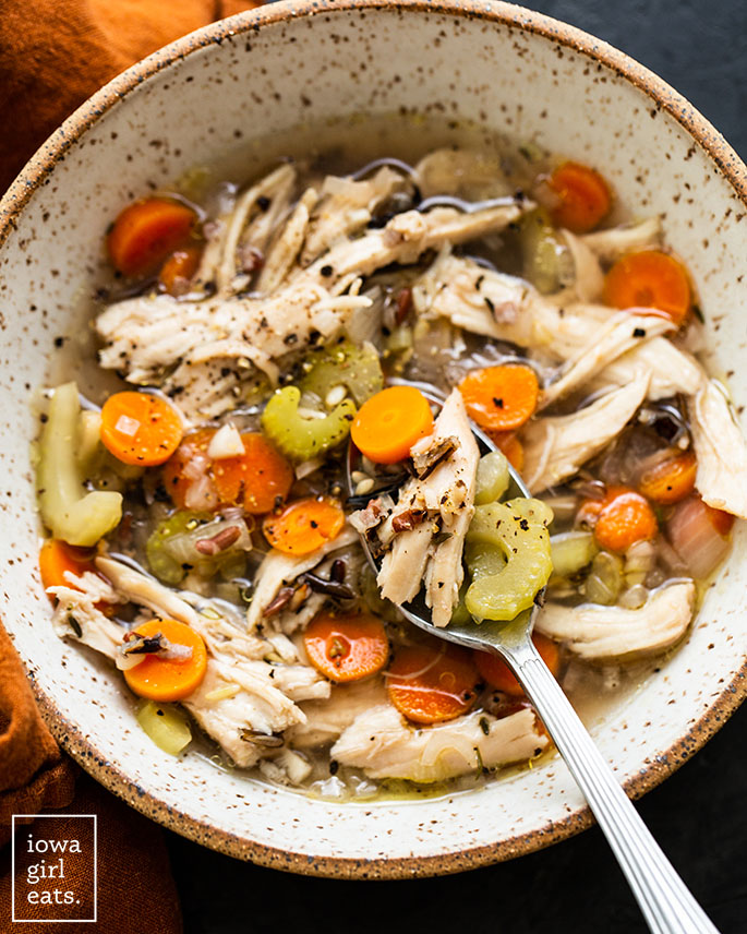 overhead photo of a bowl of crock pot chicken wild rice soup