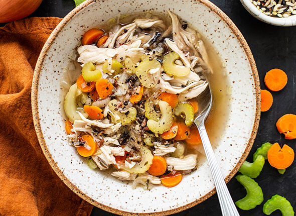 overhead photo of a bowl of crock pot chicken wild rice soup