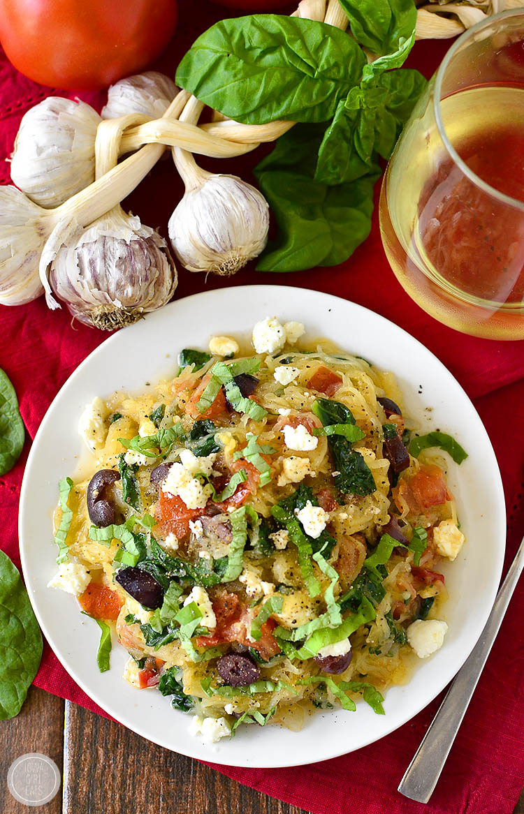 Very-Veggie Spaghetti Squash is a healthy meal packed with vegetables accented with pops of salty cheese and kalamata olives. Fresh and filling! | iowagirleats.com