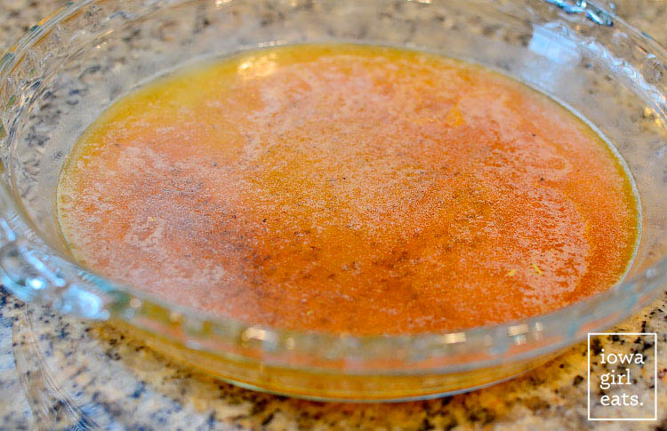 melted cajun butter in a baking dish