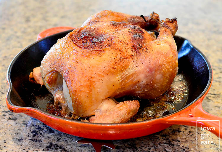 fully cooked cast iron chicken with crispy golden skin