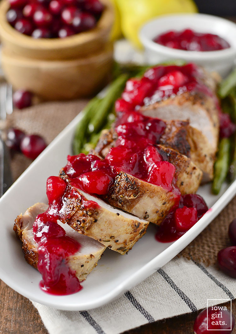 Roasted Pork Tenderloin with Cranberry-Pear Sauce is easy and filling, and features a delicious sweet-tart sauce sweetened without refined sugar! #glutenfree | iowagirleats.com
