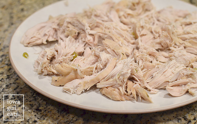 shredded crock pot chicken cooling on a plate