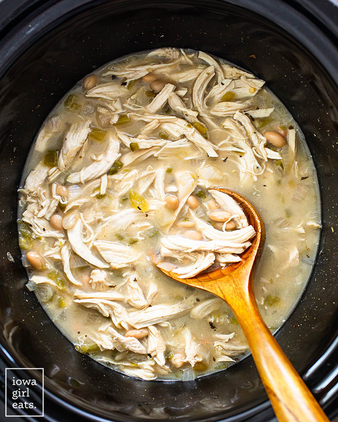 spoon in a crock pot of White Chicken Chili