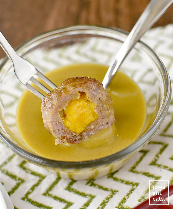 Cheddar Brat Meatballs are homemade bratwurst stuffed with gooey cheddar cheese. Serve with three, easy flavor-packed dipping sauces! #glutenfree | iowagirleats.com