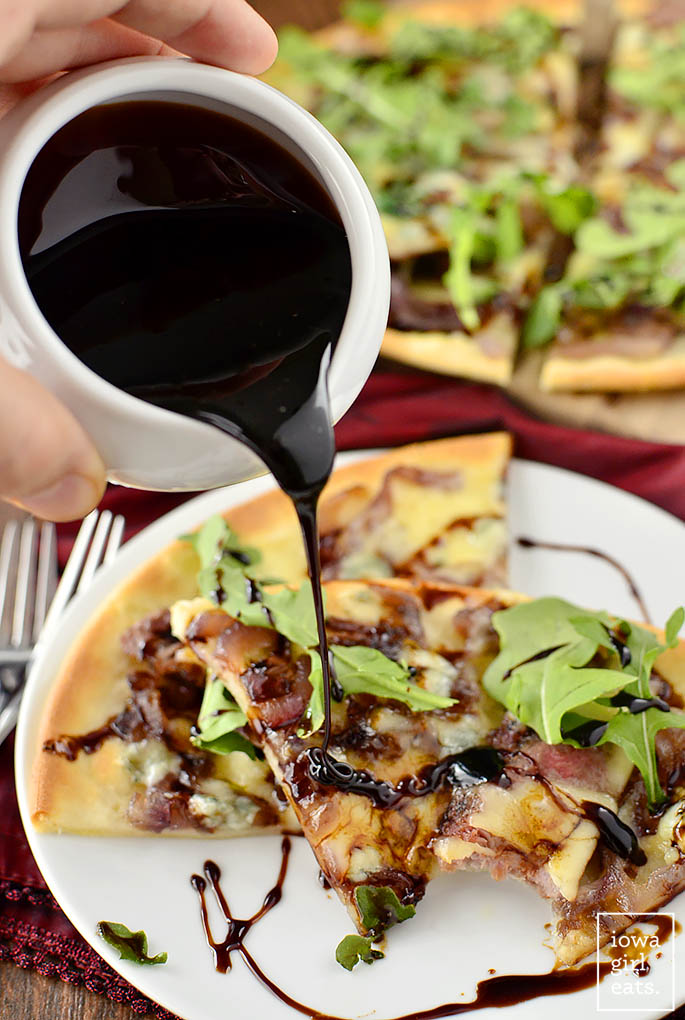 Gluten-Free Steak House Pizza is loaded with steak house favorites like buttery steak, caramelized onions, balsamic reduction, and two types of cheeses! | iowagirleats.com