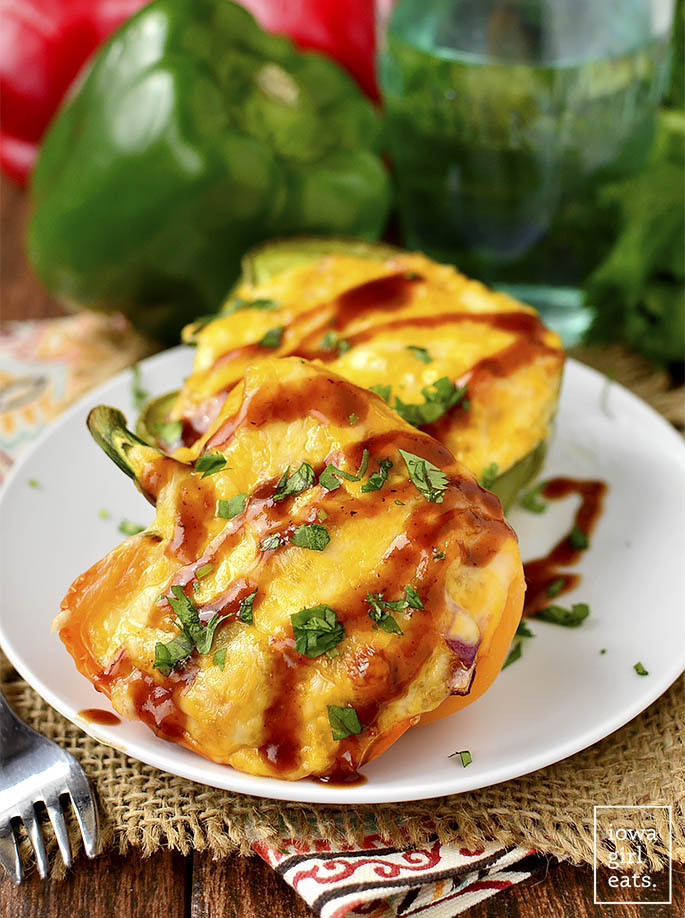 BBQ Chicken Quinoa Stuffed Peppers are full of flavor yet light and healthy. This gluten-free dinner recipe couldn't be more delicious! | iowagirleats.com