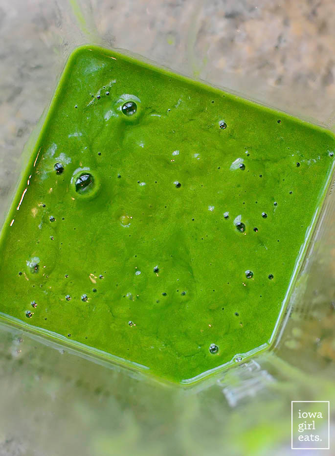 green spinach smoothie in a blender